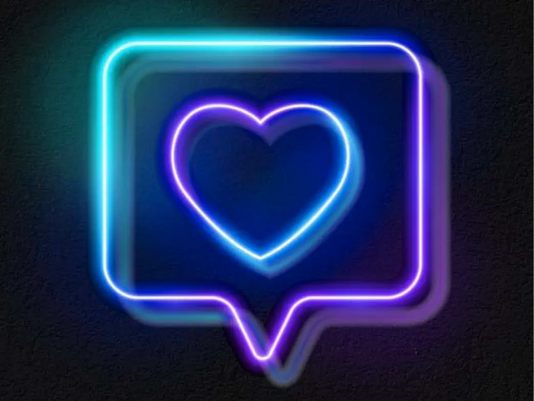 Neon-Sprechblase mit Herz-Symbol in Blau und Lila.